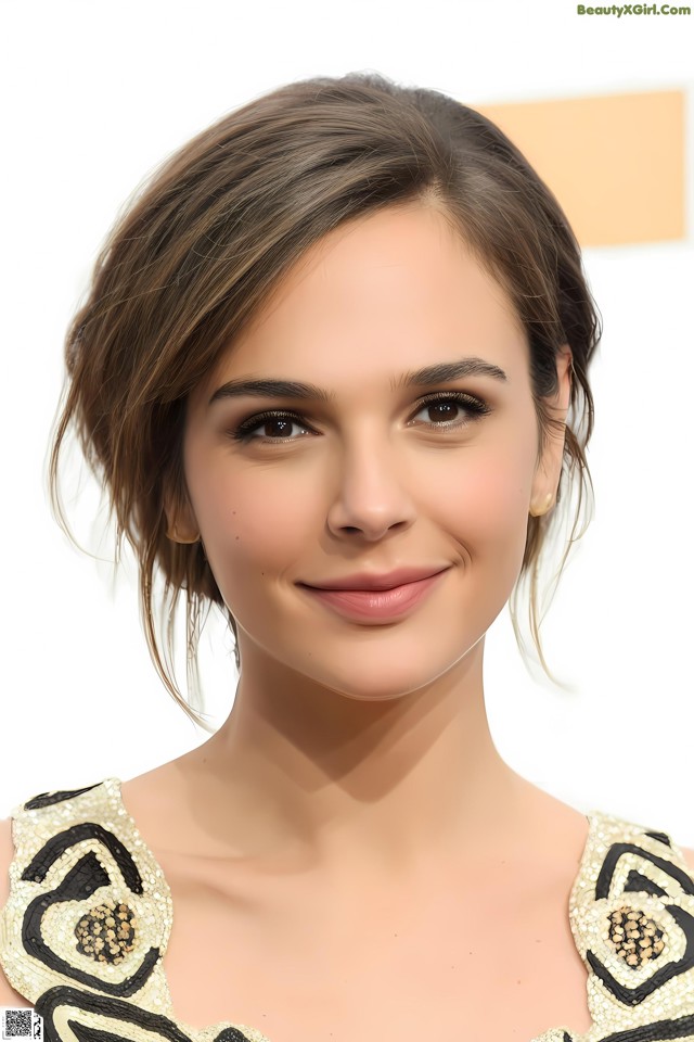 A close up of a woman with a short brown hair.